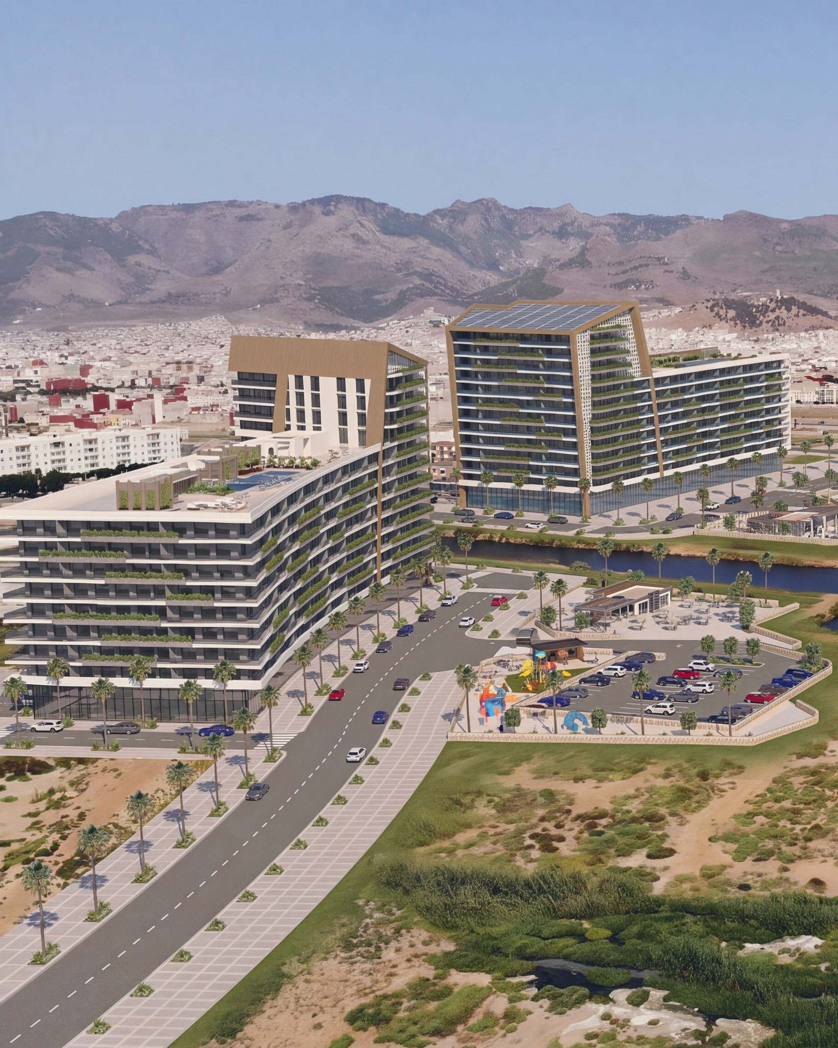 Hay El Matar, perspective de l’architecte : vue aérienne des deux immeubles aux cadres de bois doré, au bord du canal qui rejoint la lagune, la ville de Nador et les montagnes à l’horizon.