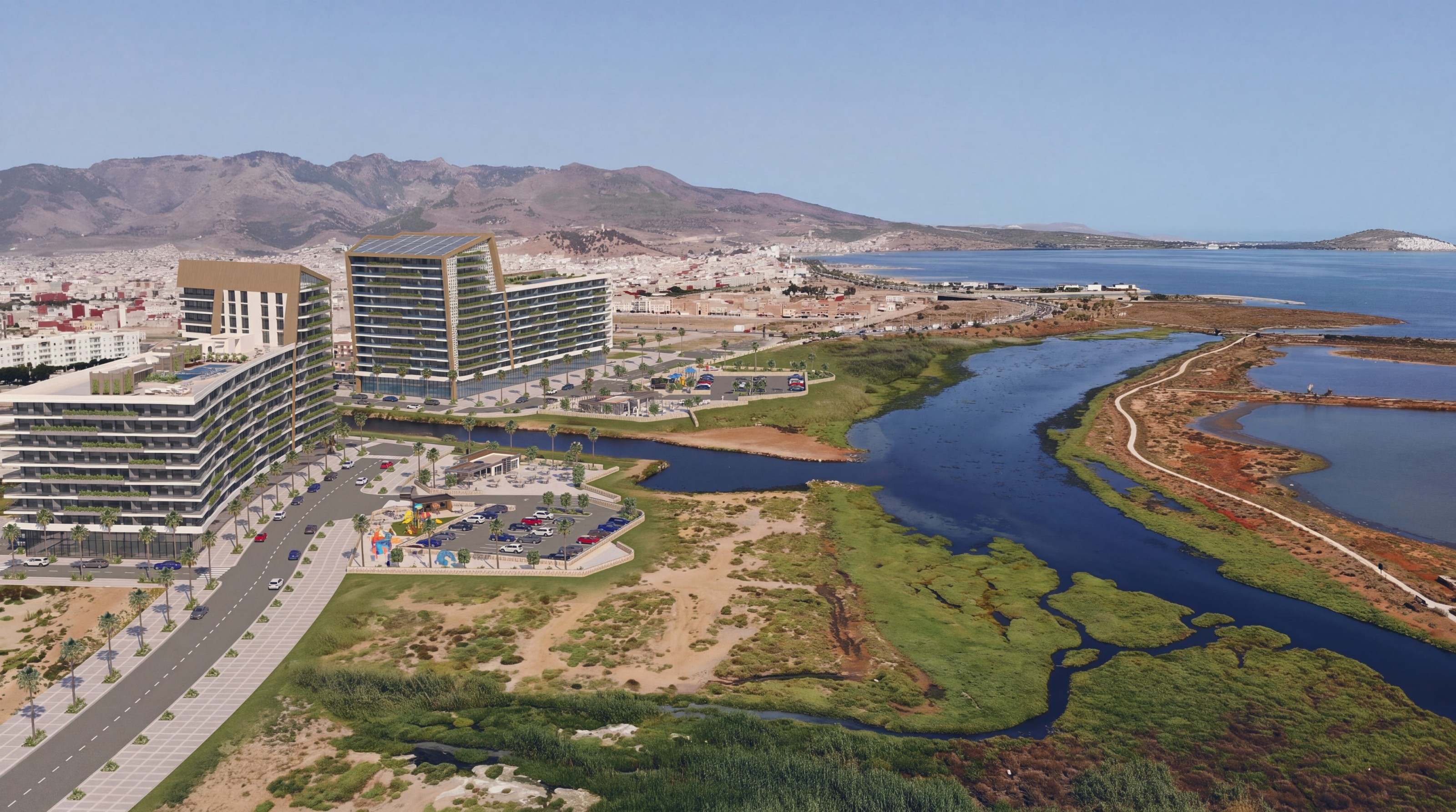 Vue aérienne de Hay El Matar : les deux immeubles au bord du canal qui rejoint la lagune de Nador, la ville et les montagnes à l’horizon — perspective d’architecte.